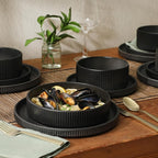 Gibson Elite Deerfield 16-Piece Stoneware Dinnerware Set – Matte Black Reactive Glaze Plates and Bowls, Stackable, Modern Design, Service for 4 – Microwave & Dishwasher Safe